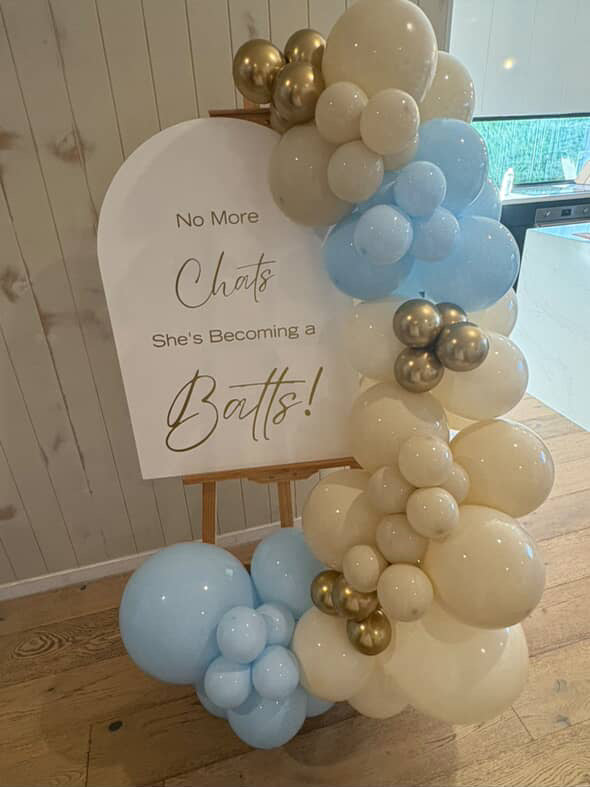 Welcome sign with balloon garland